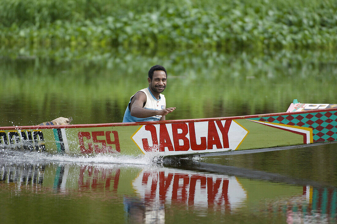 Man in motor boat, Indonesia