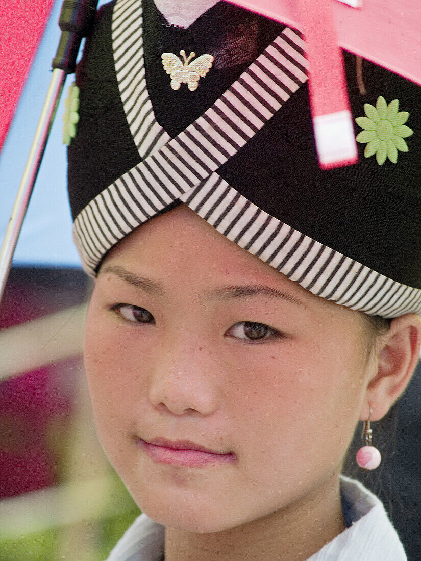 Close up of Hmong girl with traditional dress, Luang Prabang, Laos