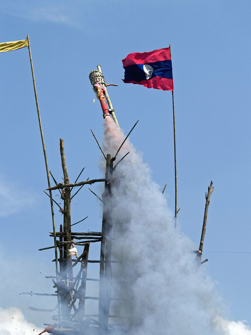 Bamboo rocket launches into the sky at the Ban Bung Fai Rocket Festival, Laos