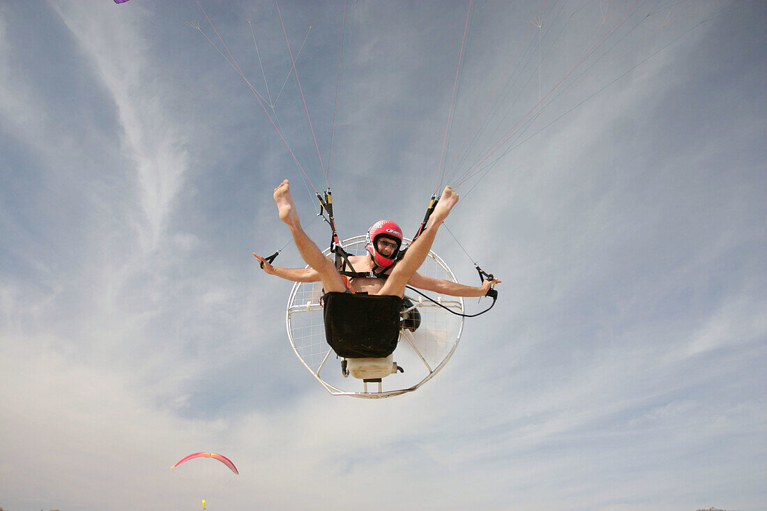Man flying with a parachute. Beach. Engine. Valencia. Spain.