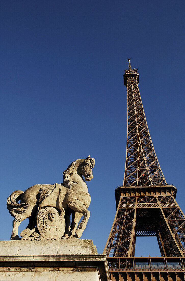 Statue on Pont de l'Alma with Eiffel Tower in background, Paris, France