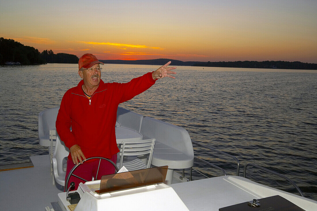 Man on a boat, lake Wannsee, Berlin, Germany