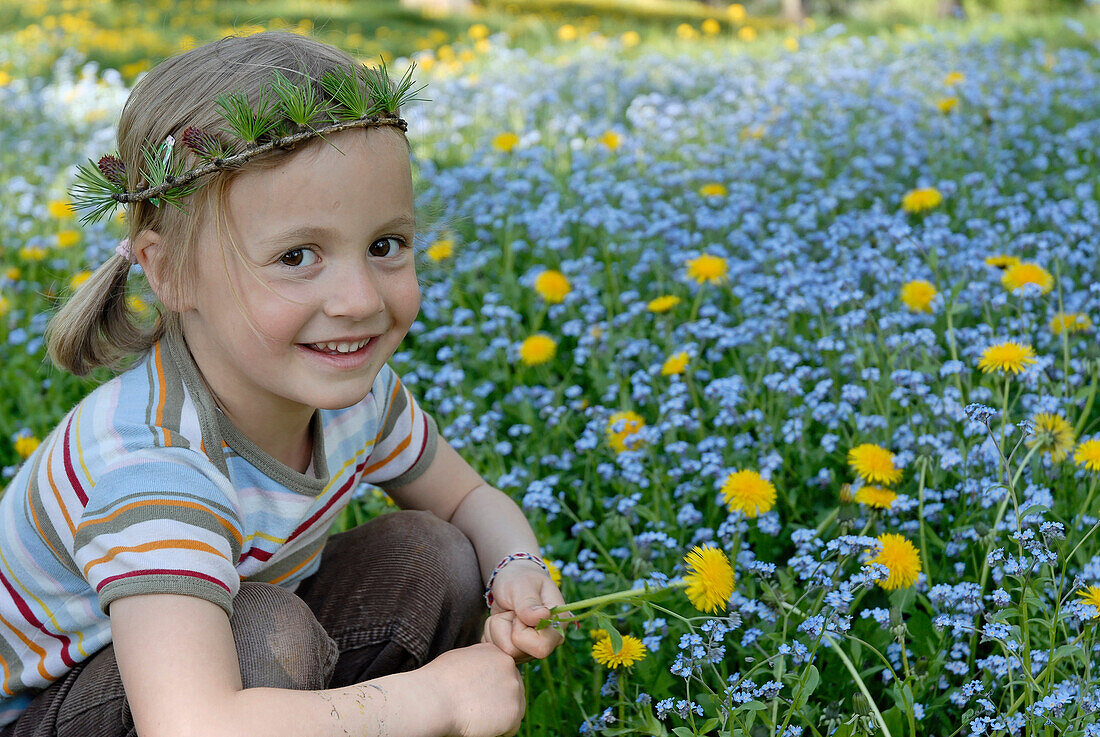 Smiling girl on a flower meadow, South Tyrol, Italy, Europe