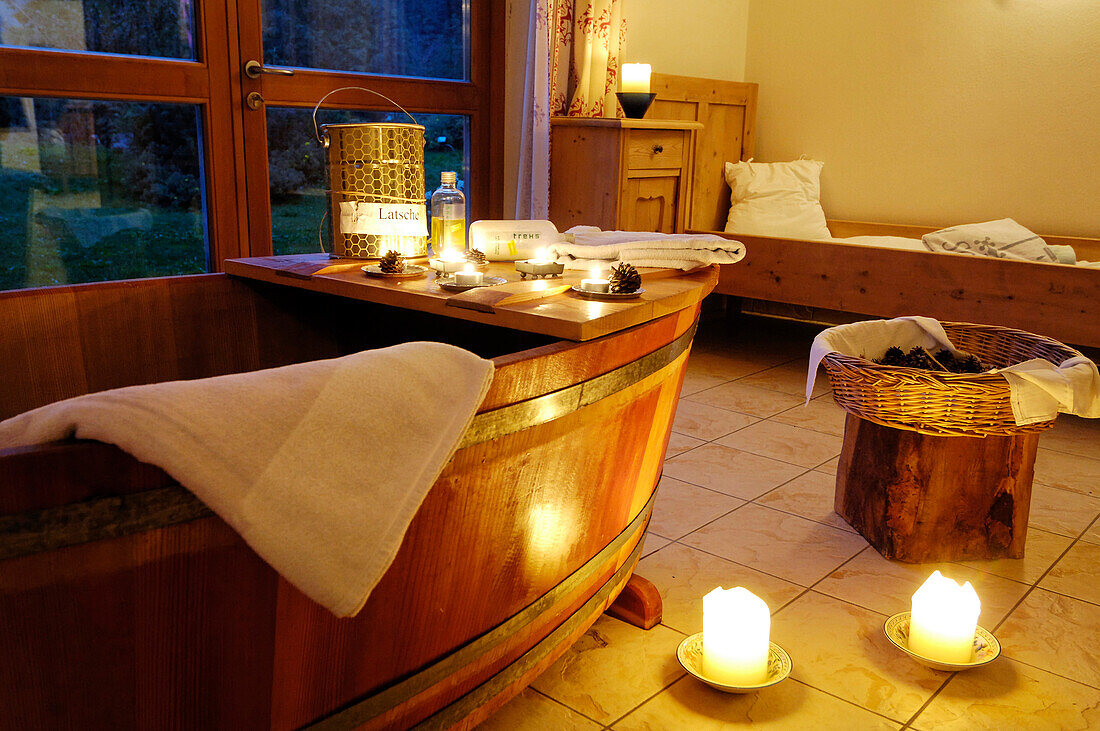 Wooden bathtub and candles at the spa of Hotel Bad Schörgau, Bad Schörgau, Valley Sarntal, South Tyrol, Italy, Europe