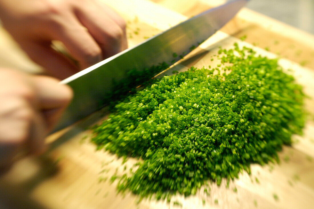 Minced chives and a knife on a cutting board, Restaurant Steinbock, Villanders, Valle Isarco, South Tyrol, Italy, Europe