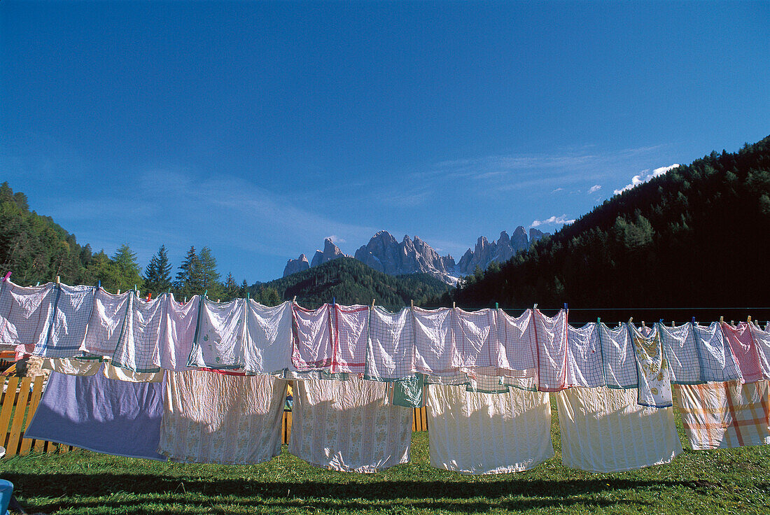 Washing hanging on the washing line, Hotel near St. Magdalena church, Geisler Mountain Range in the background, Villnoess, Funess, South Tyrol, Italy