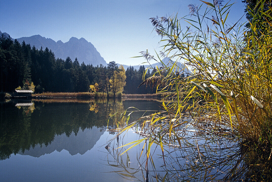 Lake with reflection, Lago di Fie, view to Monte Sciliar, Dolomite Alps, South Tyrol, Italy