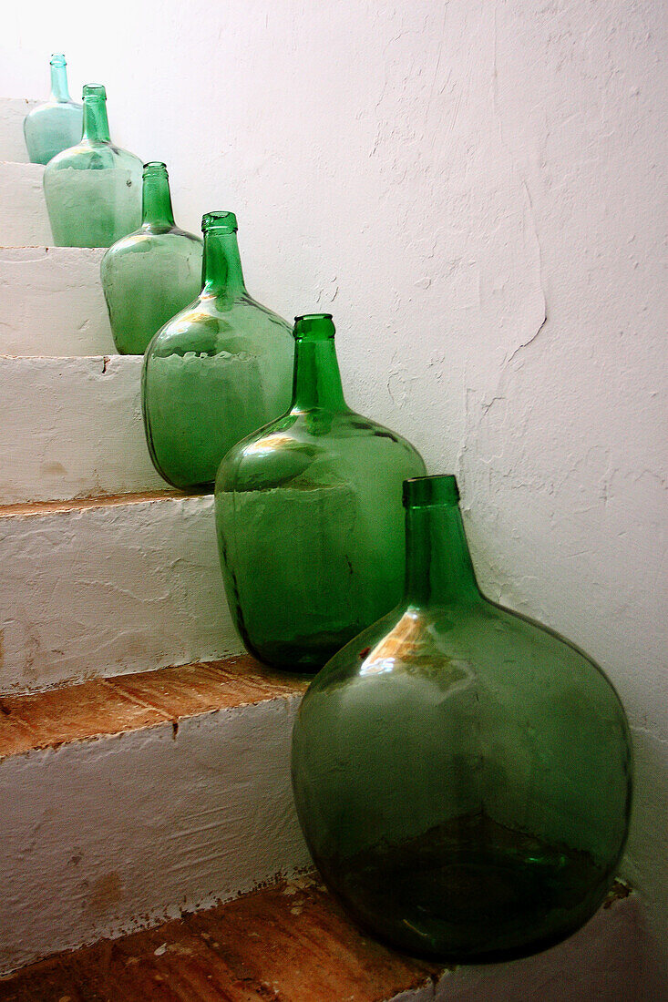 Old glass jars on steps
