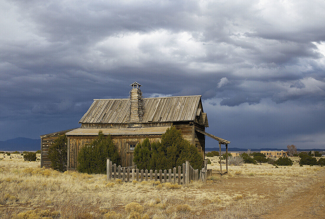 Pararie House in New Mexico with storm clouds.