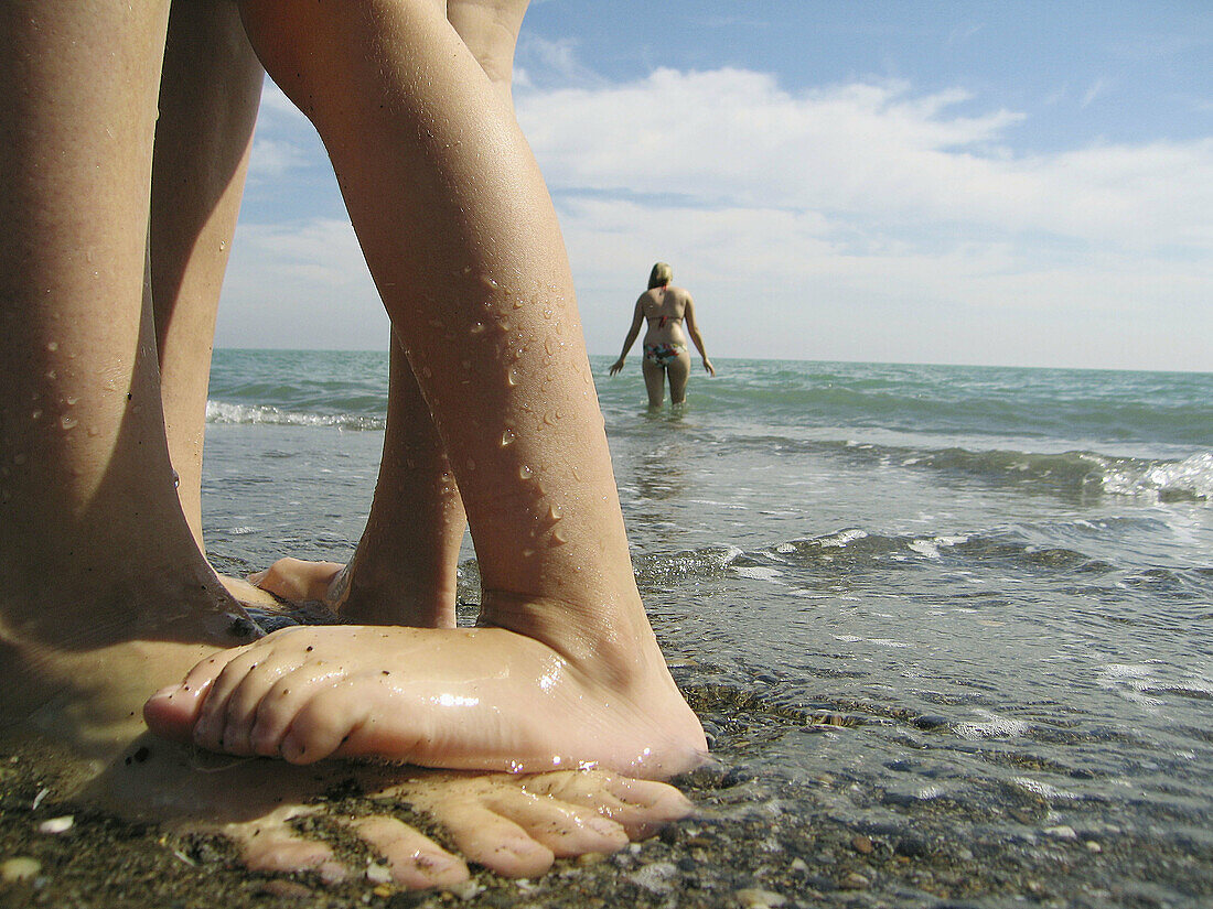 Adult, Adults, Affection, Anonymous, Barefeet, Barefoot, Beach, Beaches, Bond, Bonding, Bonds, Child, Children, Color, Colour, Contemporary, Daytime, Detail, Details, Exterior, Families, Family, Feet, Fondness, Foot, Holiday, Holidays, Human, Infant, Infa