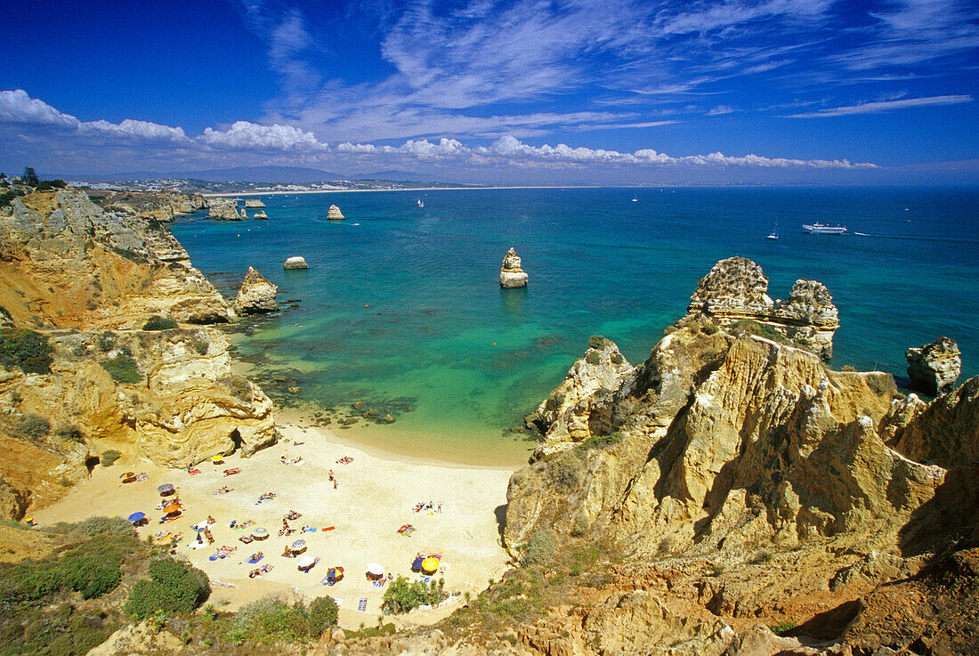 Beach and rocky coast in the sunlight, Praia do Camilo, Algarve, Portugal, Europe