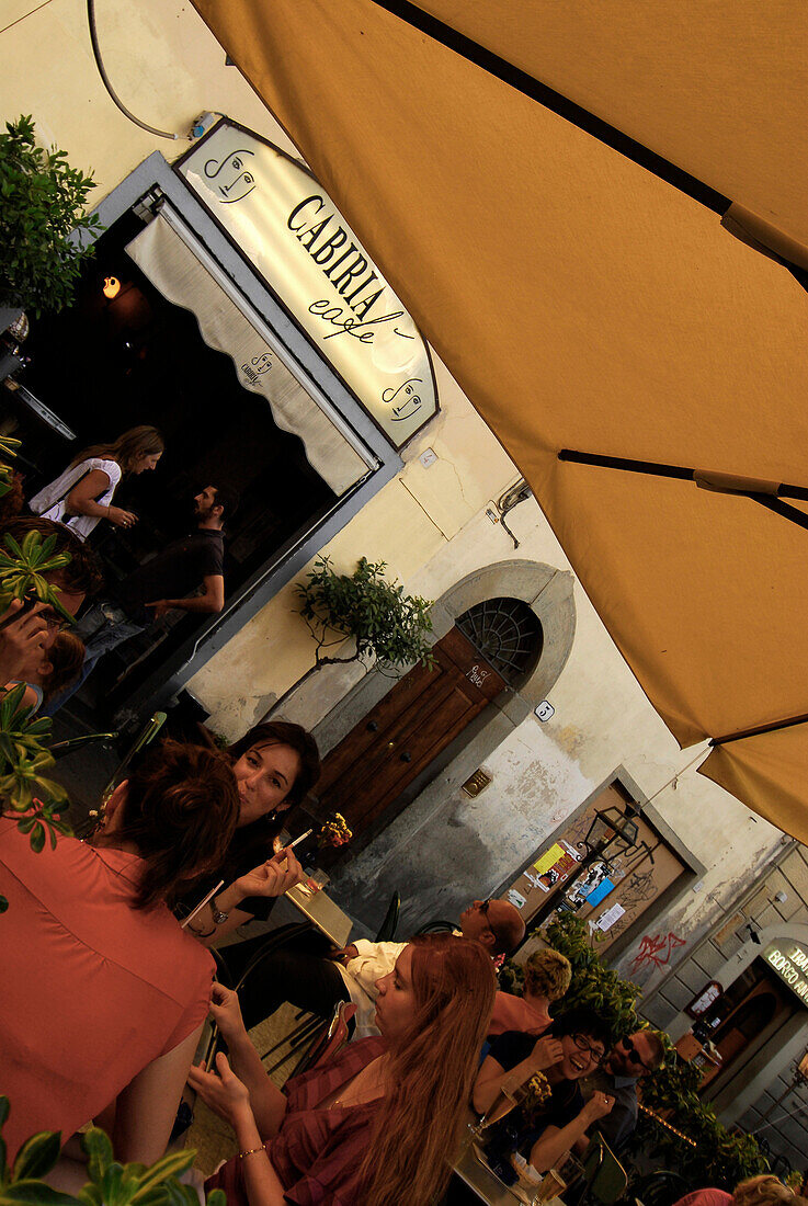 People sitting in front of the Cabiria Cafe under a sunshade, Piazza Santo Spirito, Florence, Tuscany, Italy, Europe