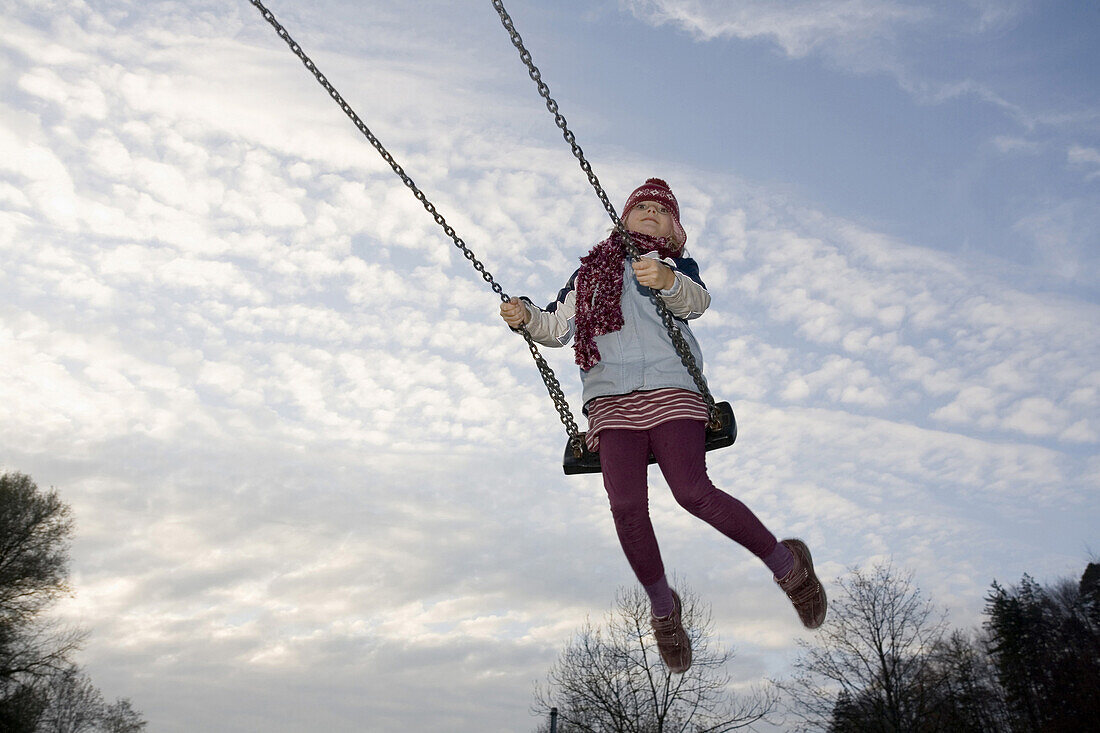 Girl swinging, München, Bavaria, Germany