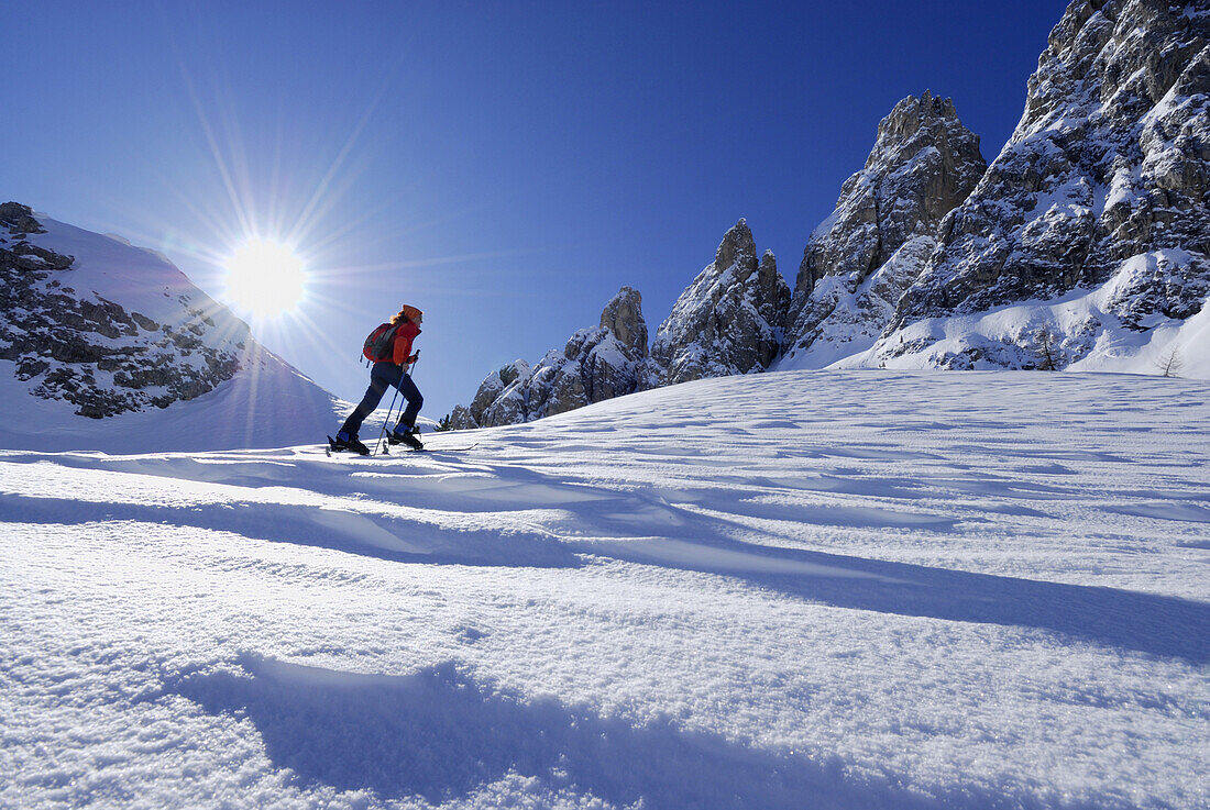 Woman backcountry skiing, Cadini range, Dolomites, Trentino-Alto Adige/Südtirol, Italy