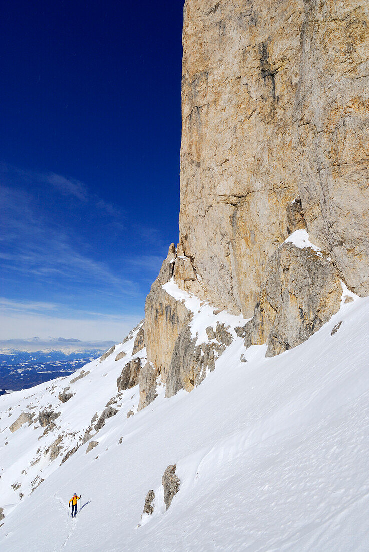 Woman backcountry skiing, Rotwand, Rosengarten group, Dolomites, Trentino-Alto Adige/Südtirol, Italy