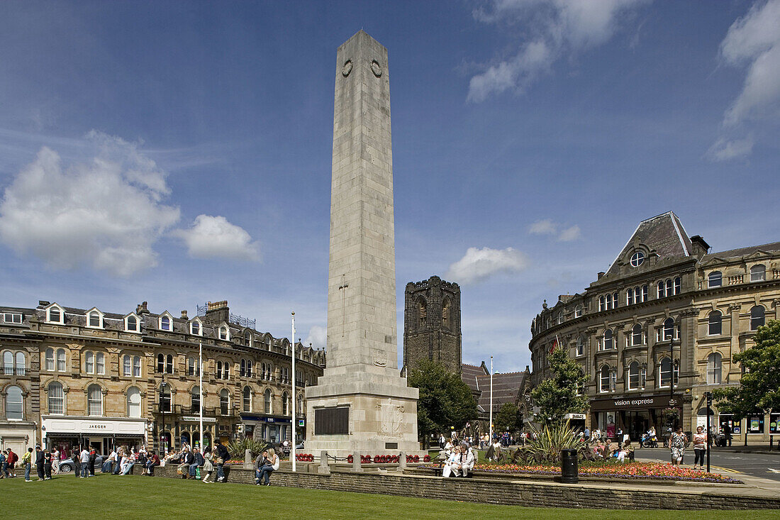 Harrogate, Cenotaph, War Memorial, by the sixth Earl of Harewood in 1923, the tower of St. Peters Church, North Yorkshire, UK