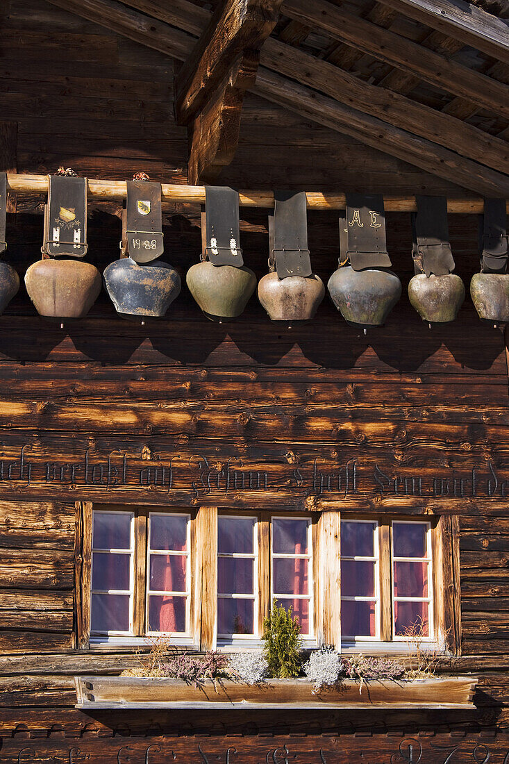 Row of cow bells, mountain restaurant Aebi, Adelboden, Bernese Oberland, Canton of Berne, Switzerland