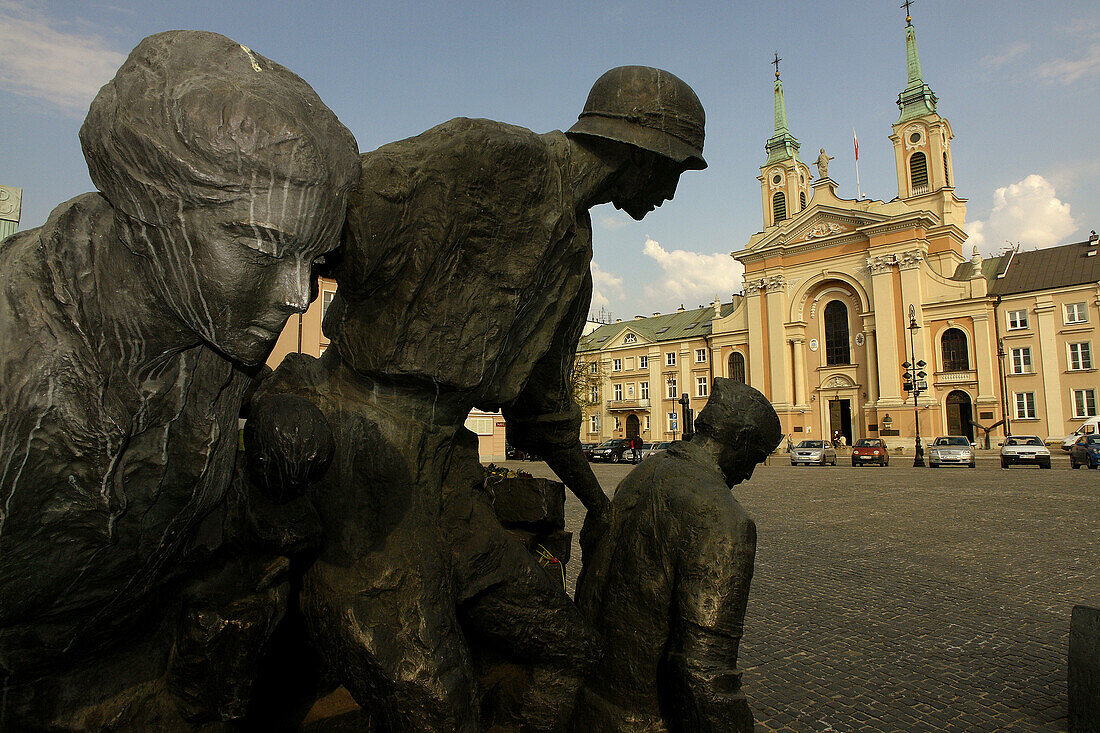 Monument to the Warsaw Uprising and Church of Our Lady Queen of the Polish Crown in background, Warsaw old town, Poland
