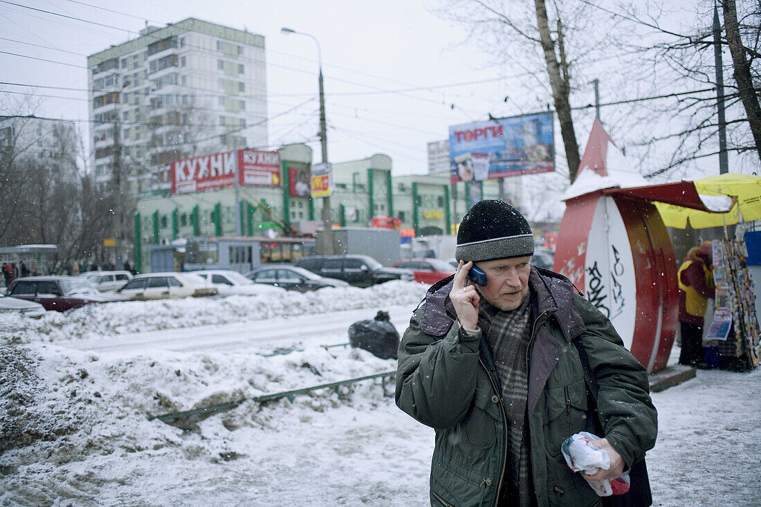 Man using cell phone, Moscow, Russia