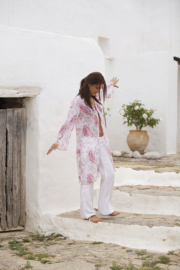 Young woman keeping her balance.