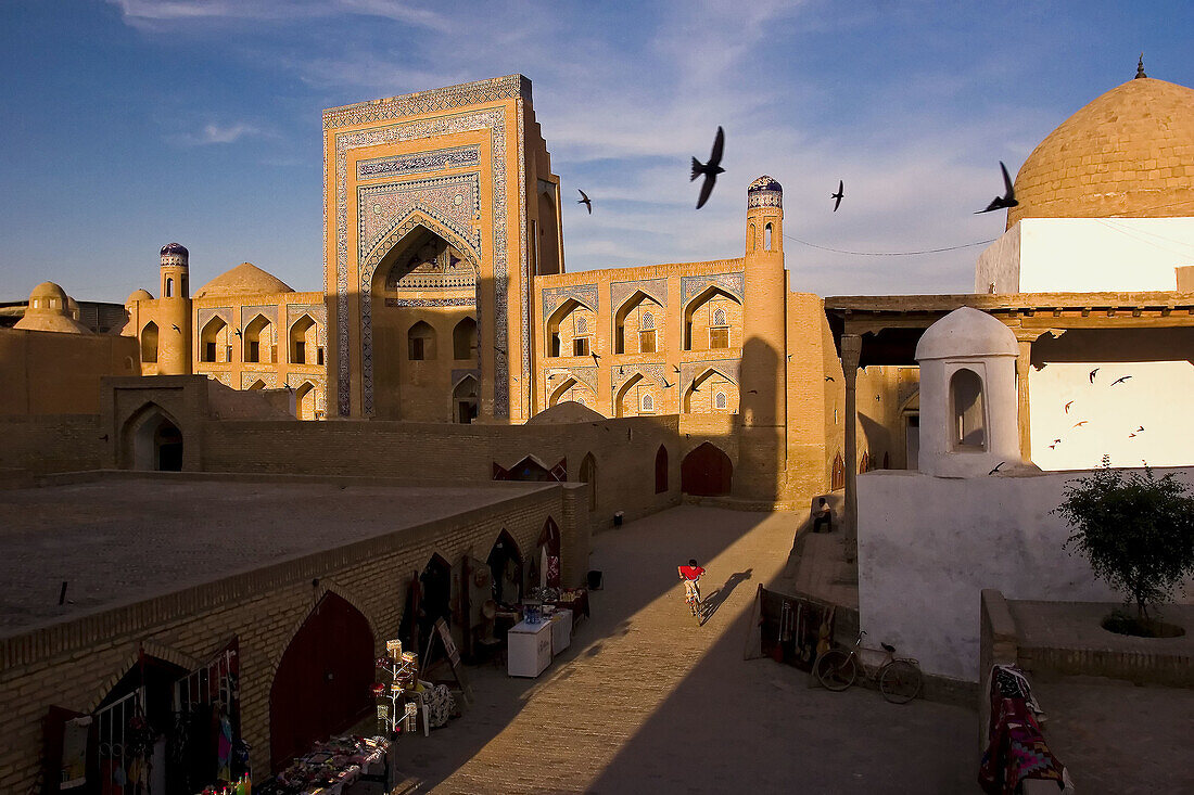 Cityscape of Madrassas (islamic schools) and Mosques of old Khiva at sunset, Khiva, Uzbekistan