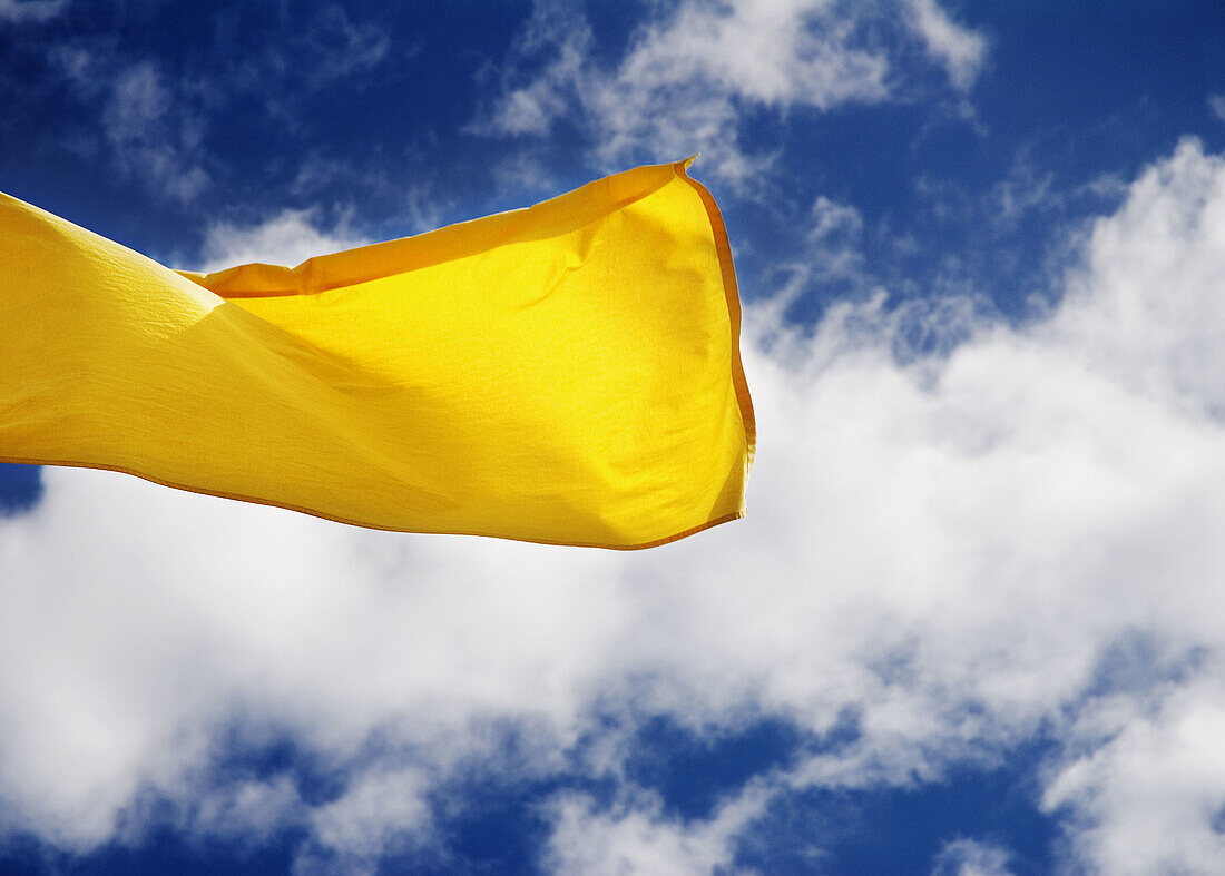 Yellow flag on beach (information about sea conditions)