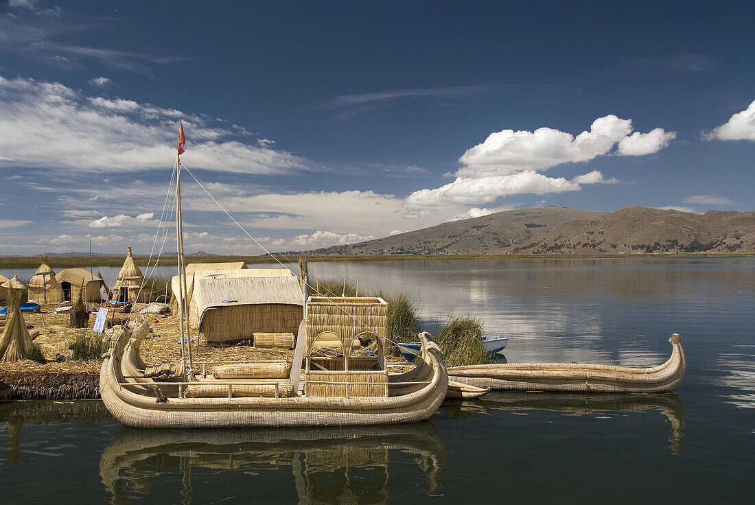 Peru, Lake Titicaca, floating islands of the Uros people, traditional reed boats and reed houses