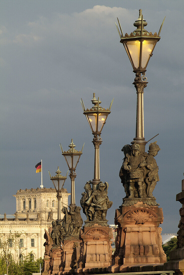 Germany, Berlin, Moltke Bridge lamp, Reichstag building in brackground