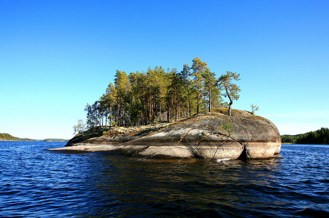 Private island on lake Saimaa under blue sky, Saimaa Lake District, Finland, Europe