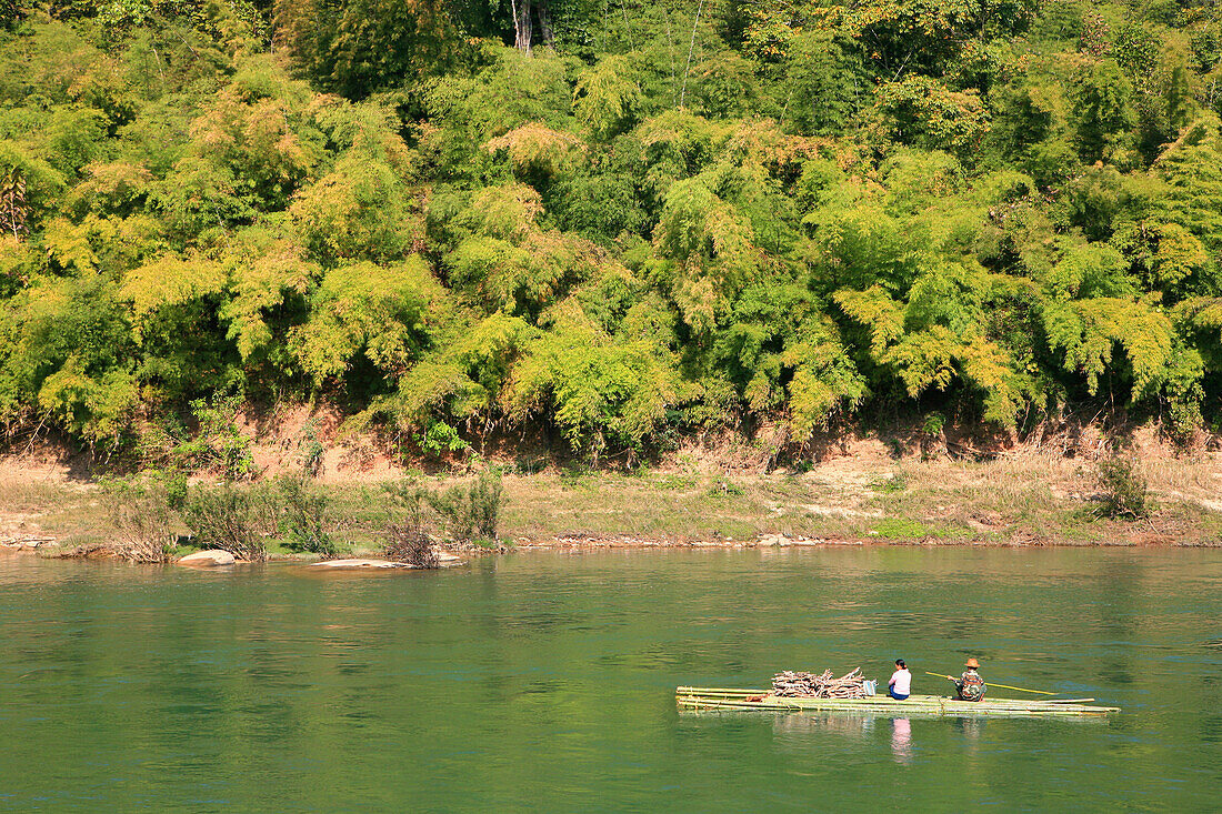 People on bamboo raft on the Namtu river, Hispaw, Shan State, Myanmar, Burma, Asia