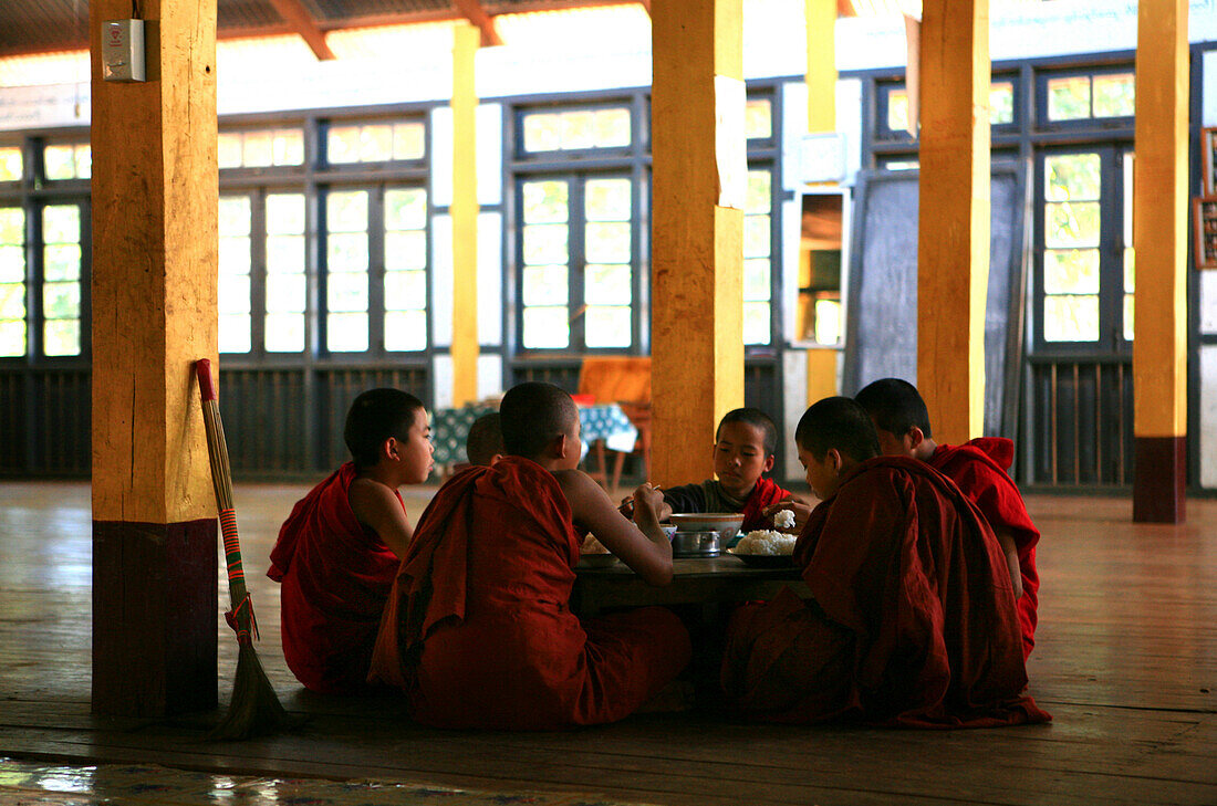 Buddhist novices eating in a forest monastery, Shan State, Myanmar, Burma, Asia