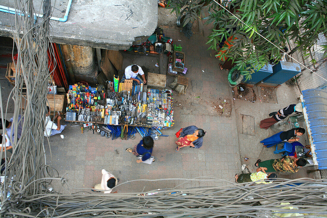 High angle view at cables, people and sales stalls, Rangoon, Myanmar, Burma, Asia