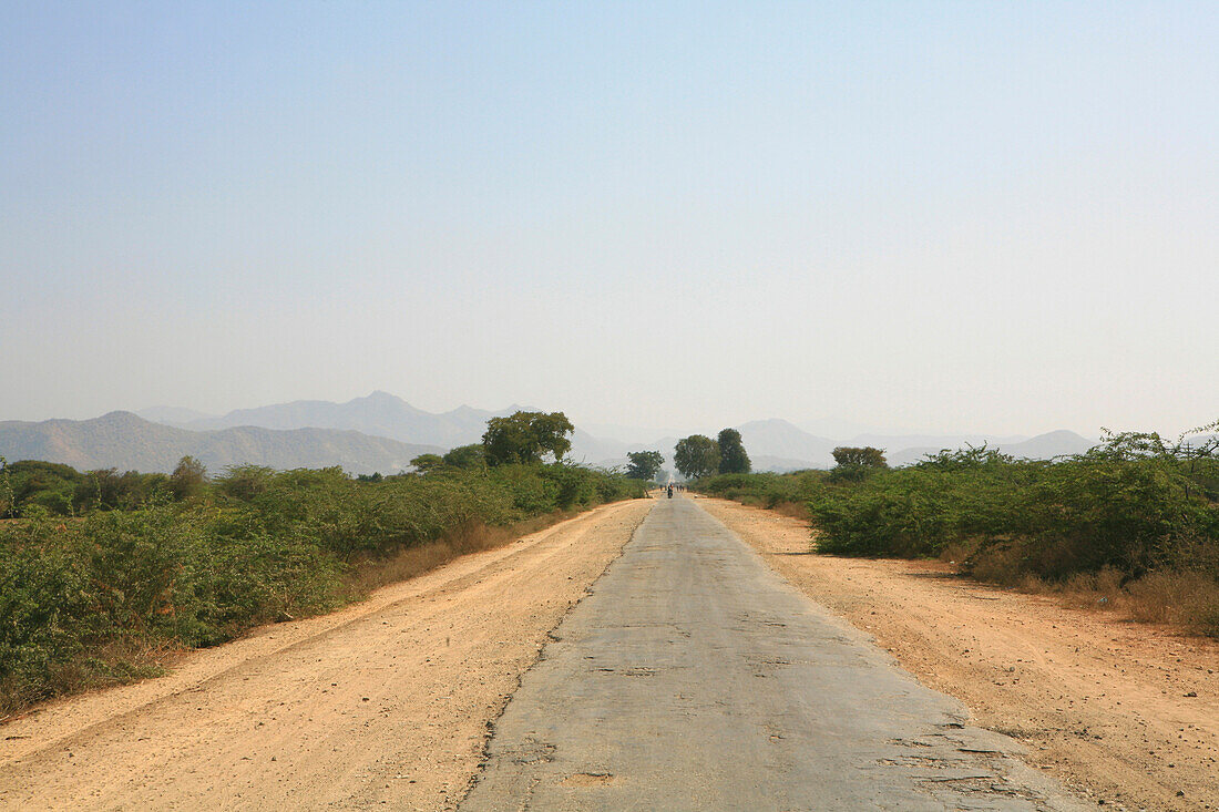 Empty country road under clear sky, Myanmar, Burma, Asia