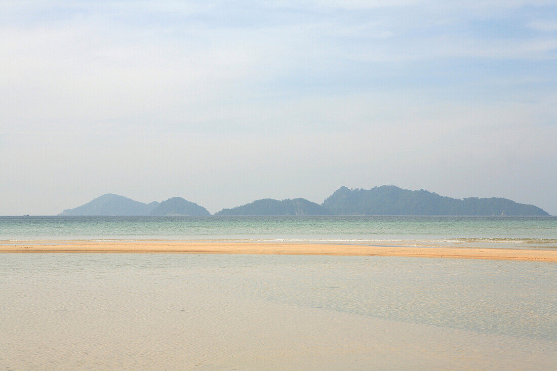 Beach on uninhabited island under clouded sky, Mergui Archipelago, Andaman Sea, Myanmar, Burma, Asia