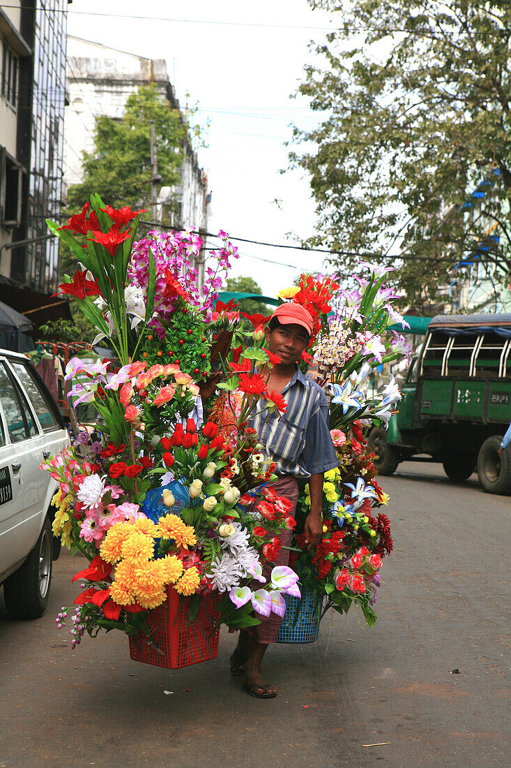 A street vendor selling flowers, Rangoon, Myanmar, Burma, Asia