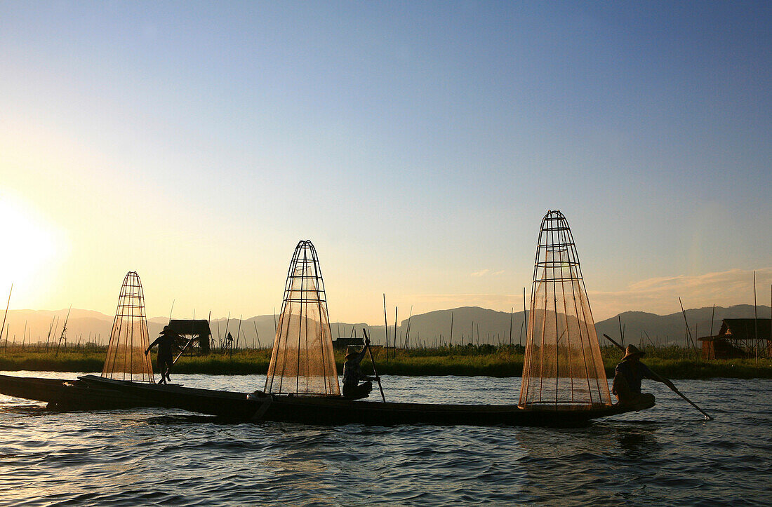 Intha fishermen with fish traps in the evening light, Inle Lake, Shan State, Myanmar, Burma, Asia