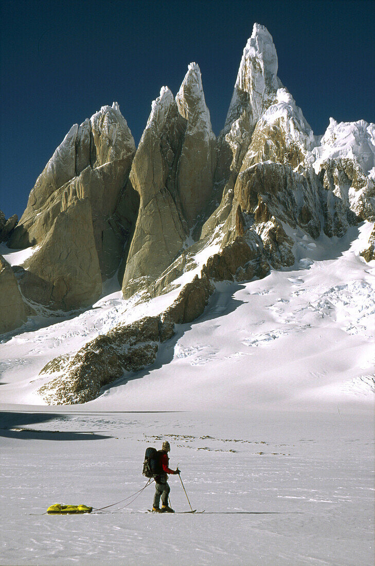 Cerro Torre west face and skier on South Patagonian icecap Los Glaciares National Park Patagonia