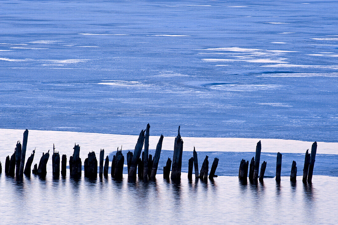Pilings and melting ice in Chequamegon Bay
