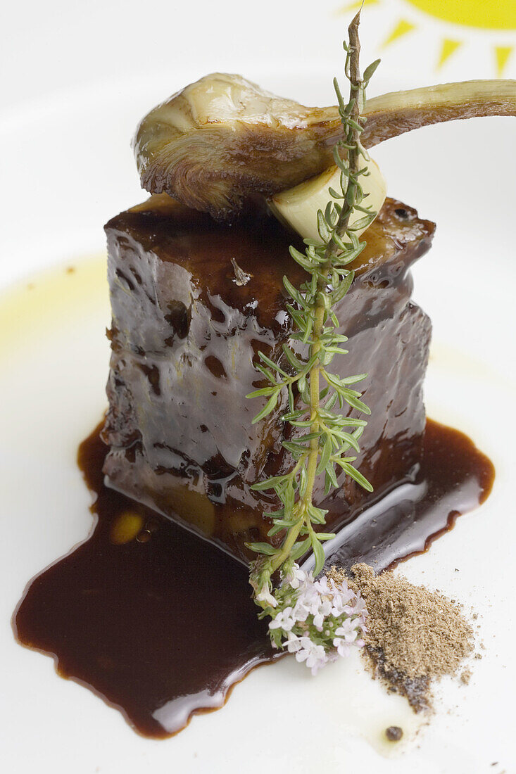 Stewed veal ham with mencia sauce and artichokes at restaurant A Rexidora by Javier Gonzalez, Bentraces. Orense province, Galicia, Spain