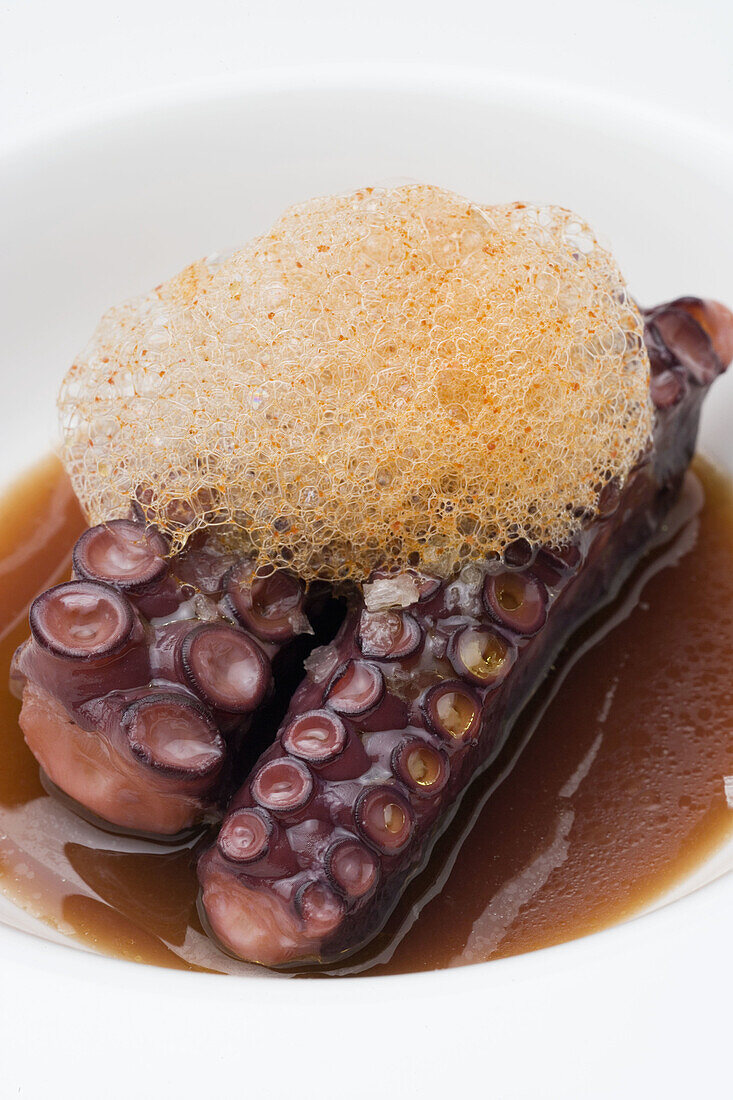 Octopus with foam of garlic sauce at restaurant Pandemonium by chef Antonio Botana, Cambados. Pontevedra province, Galicia, Spain