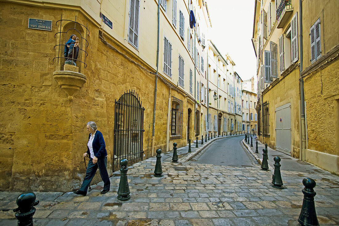 Old woman walking in Aix-En-Provence