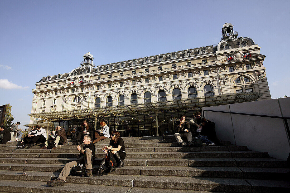 France. Paris. Musee dOrsay with visitors resting on its staircase.