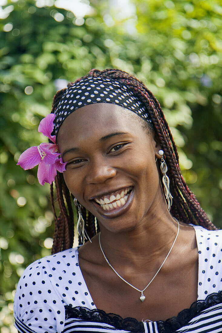 Woman with flower in hair, Sosua, … – License image – 70243966 ❘ lookphotos