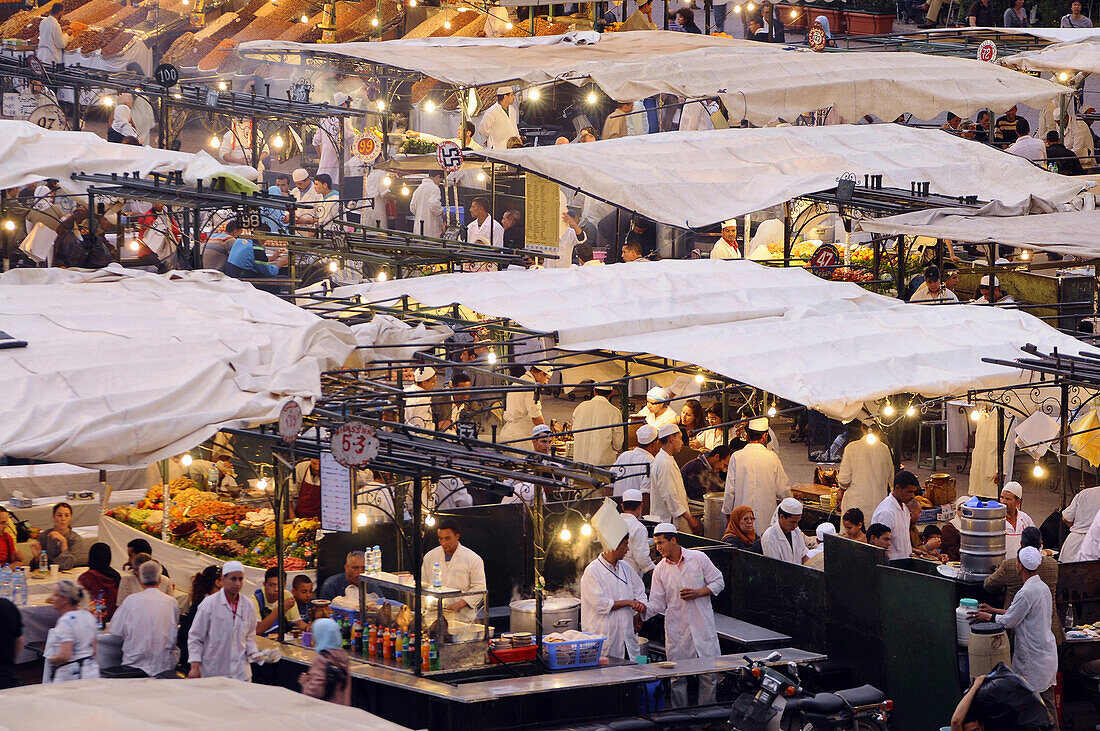 People at snack stalls on Place Jemaa el-Fna, Marrakesh, South Morocco, Morocco, Africa
