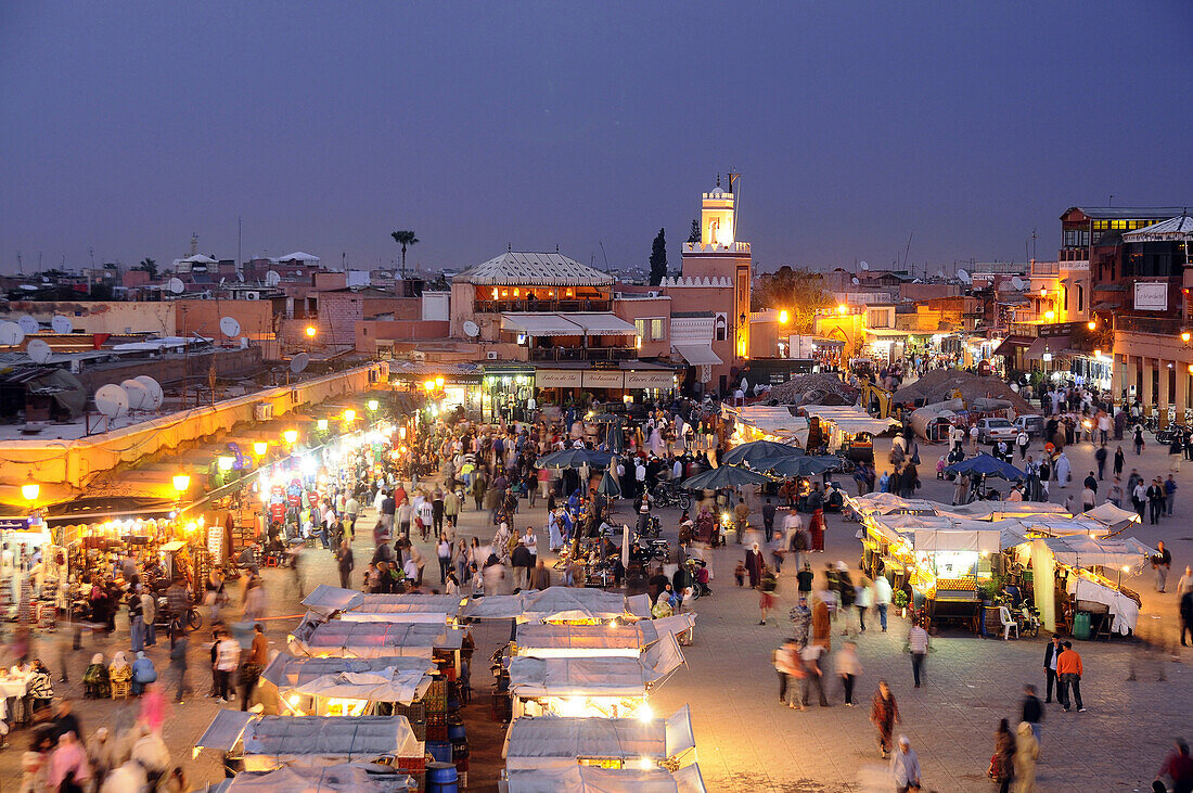 Illuminated snack stalls at the Place Jemaa el-Fna in the evening, Marrakesh, South Morocco, Morocco, Africa