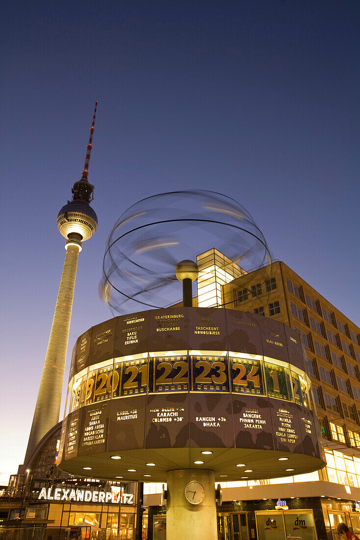 Alexanderplatz world clock TV tower at night in Berlin