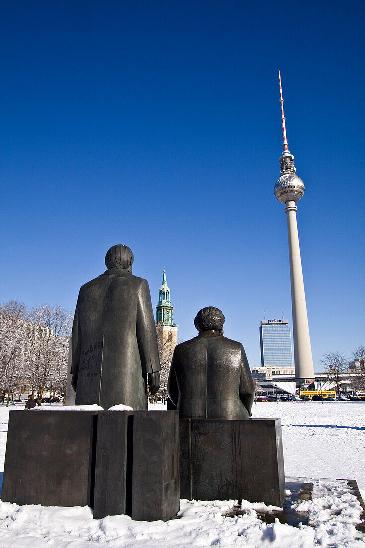 Snow landscape at Marx and Engels  sculpture , background Alex,  Berlin center