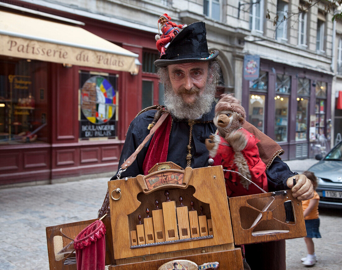 Street artist with hand organ  in historic costum with Vieux Lyon,Old city center,  Lyon, Rhone Alps,  France, Old City Center, , UNESCO World Heritage , Lyon, Rhone Alps,  France