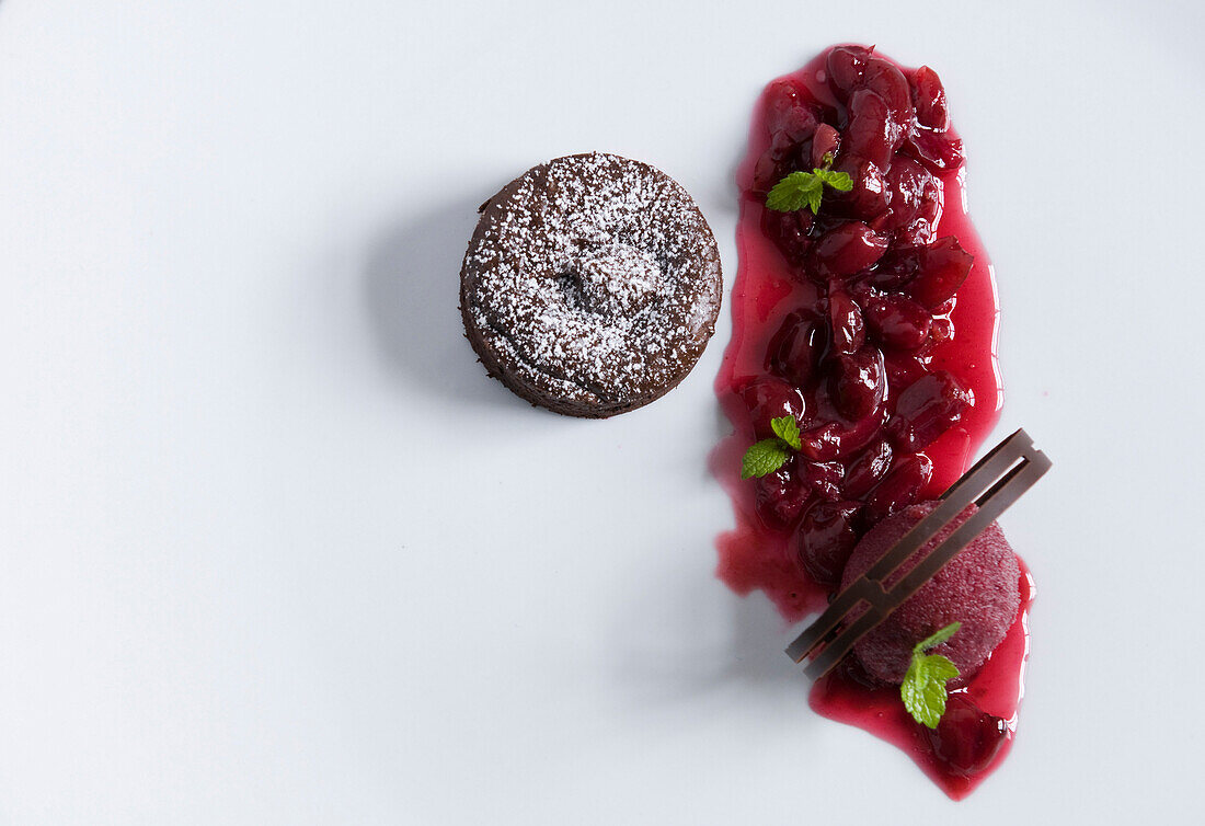 Chocolate cake with cherries and sorbet in restaurant Tilia, Chef Chris Oberhammer, Vintl, South Tyrol, Italy