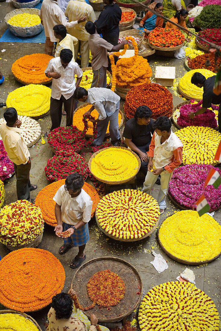 India. Bengaluru (Bangalore). City Market. Flowers necklace sellers
